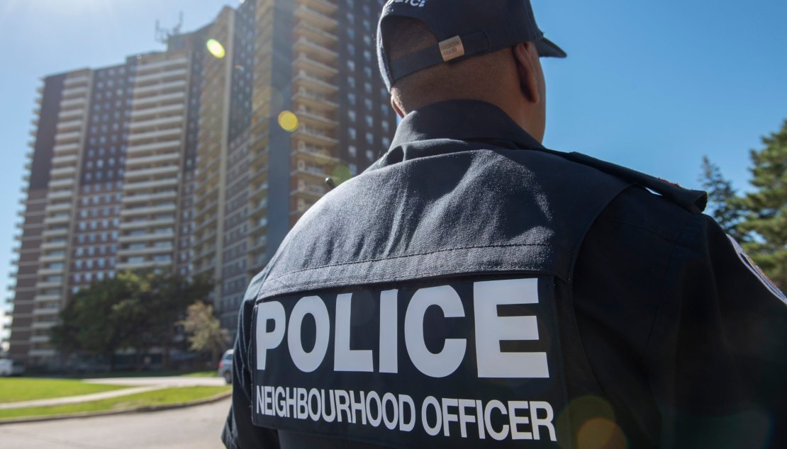 TPS Officer from behind with building in background